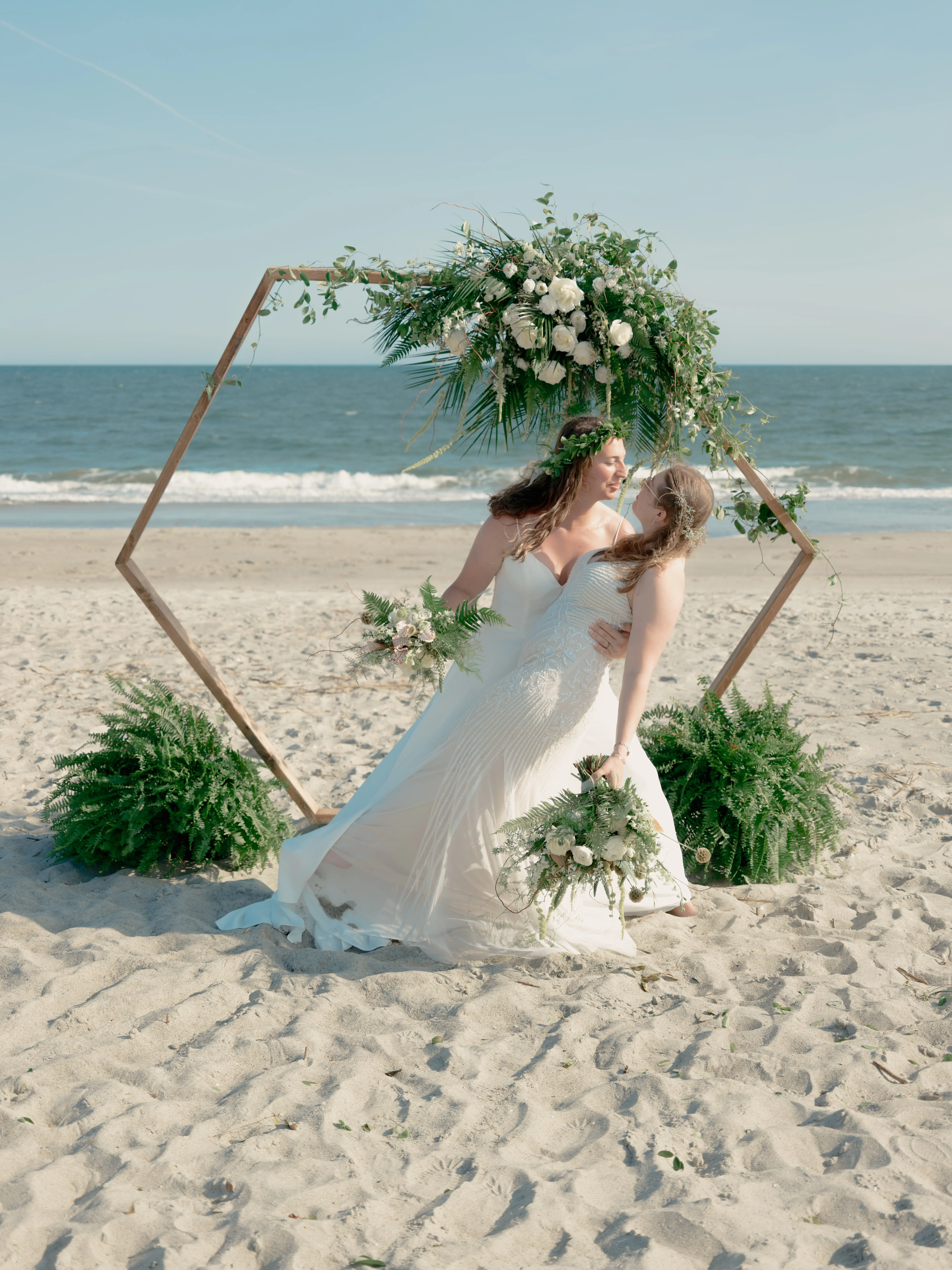 Sunset kiss with gentle hand cradling face, showcasing quiet intimacy and love