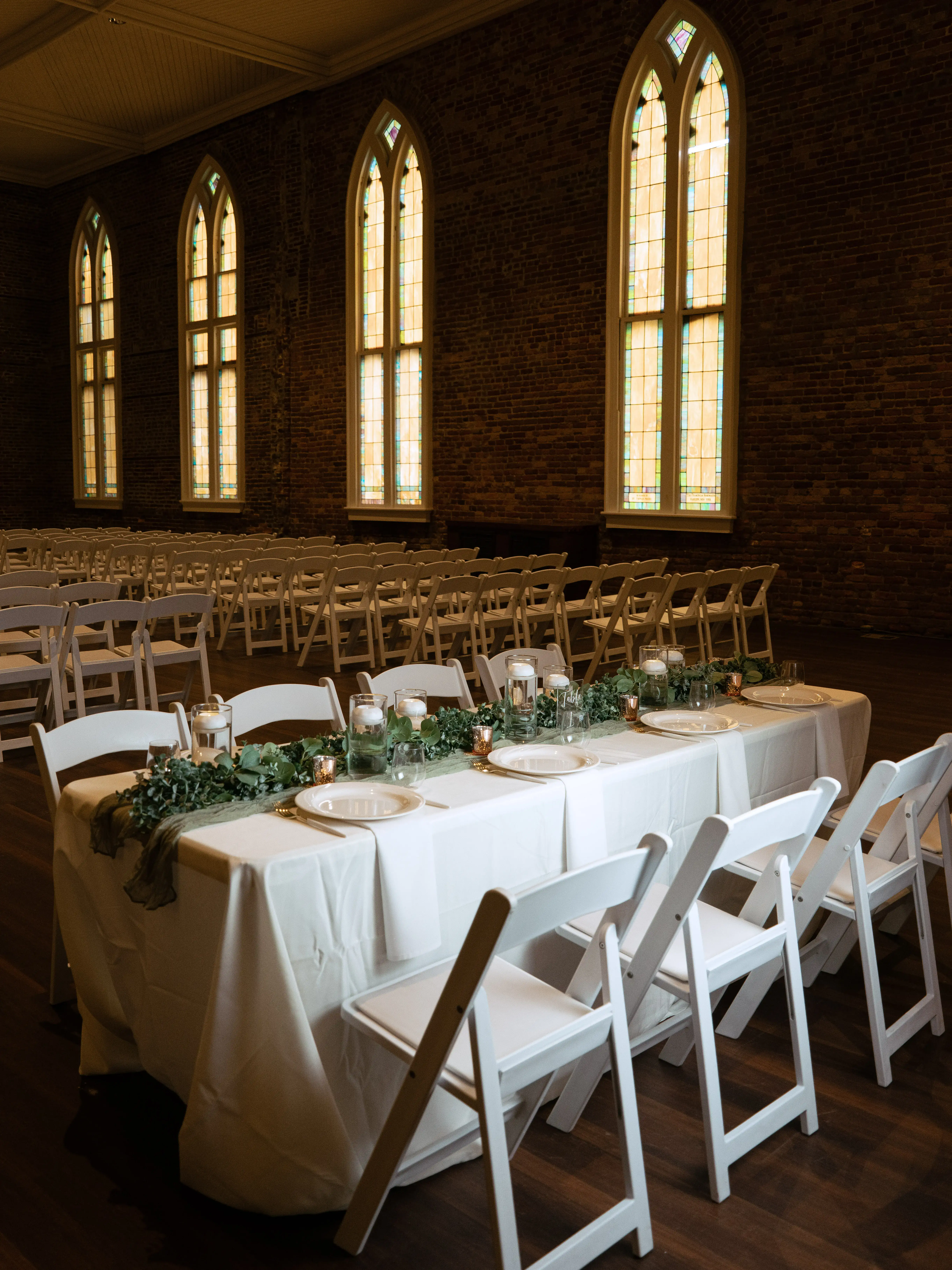 Beach ceremony with geometric arch and ocean backdrop, ethereal natural light