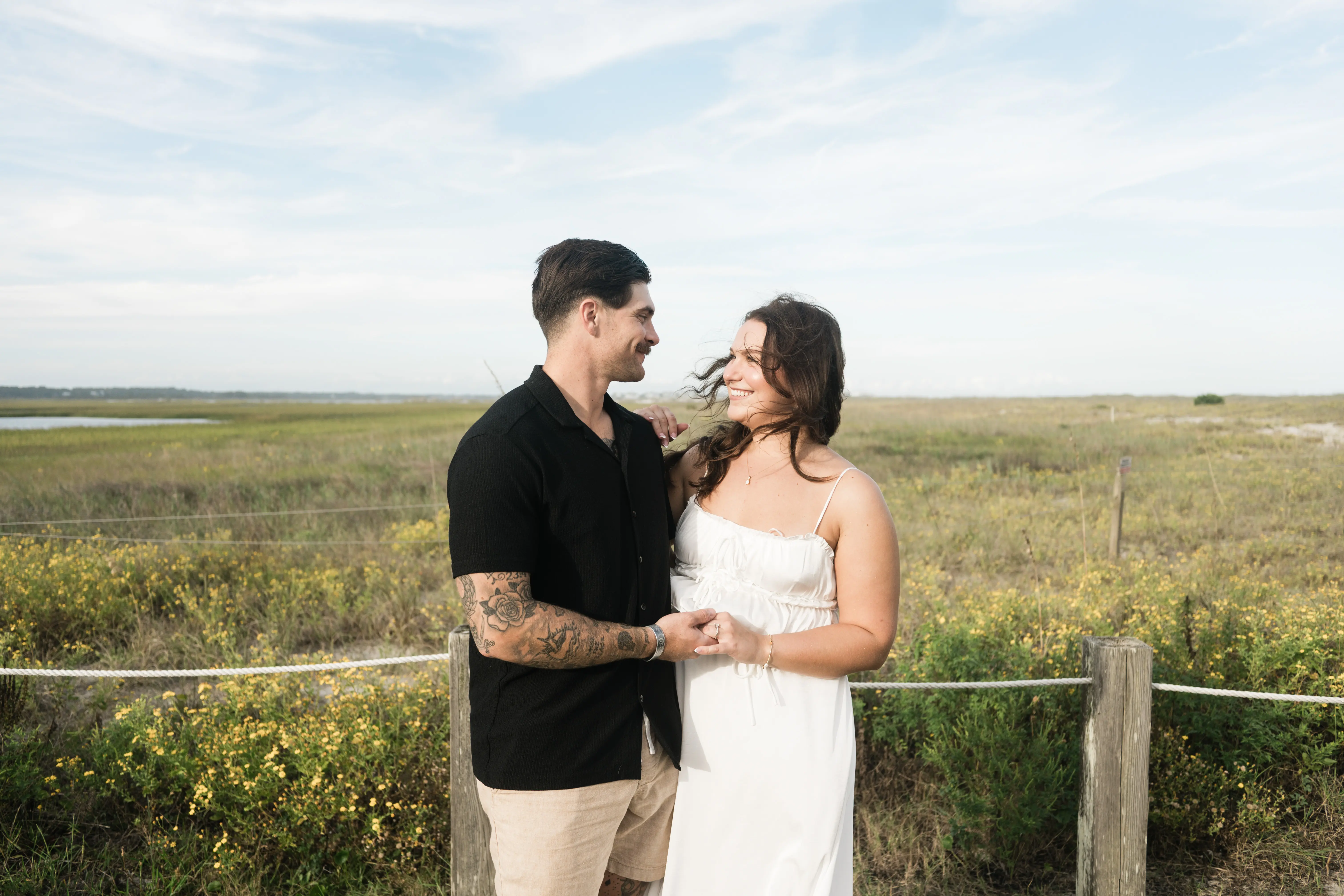 Couple dancing with dress flowing, capturing playful energy and movement