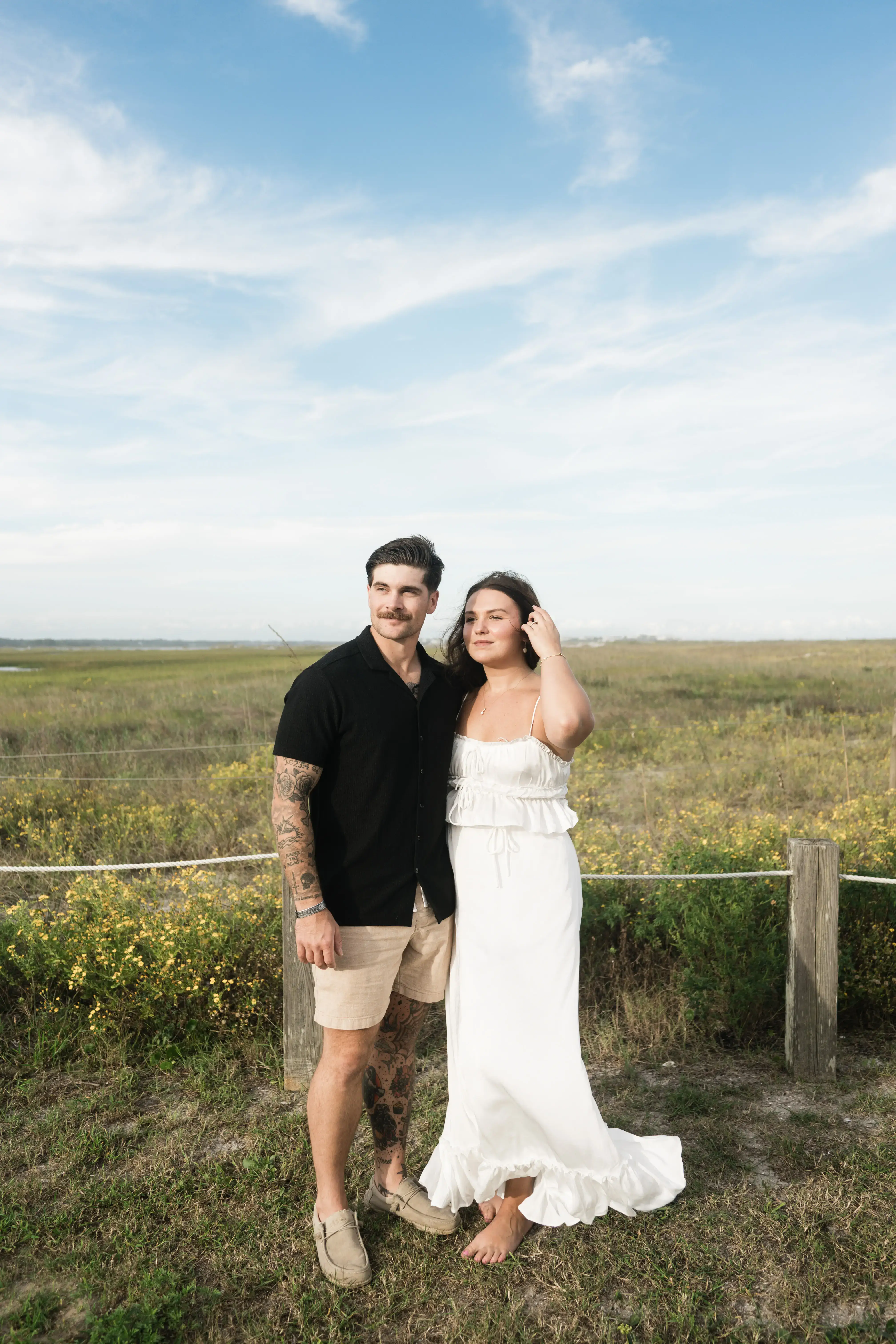 Joyful couple laughing together on their wedding day, captured in film-inspired natural light photography